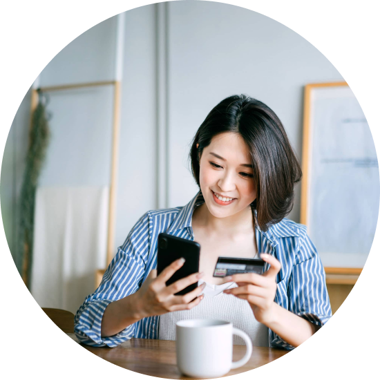 A girl making online payment happily