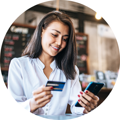 A lady making online payment transaction through phone